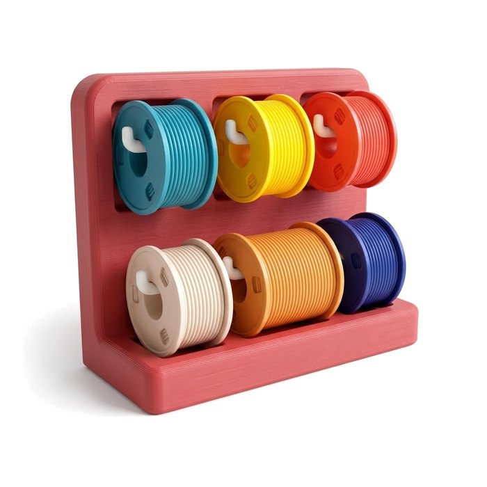 Four spools of filament: one for each color